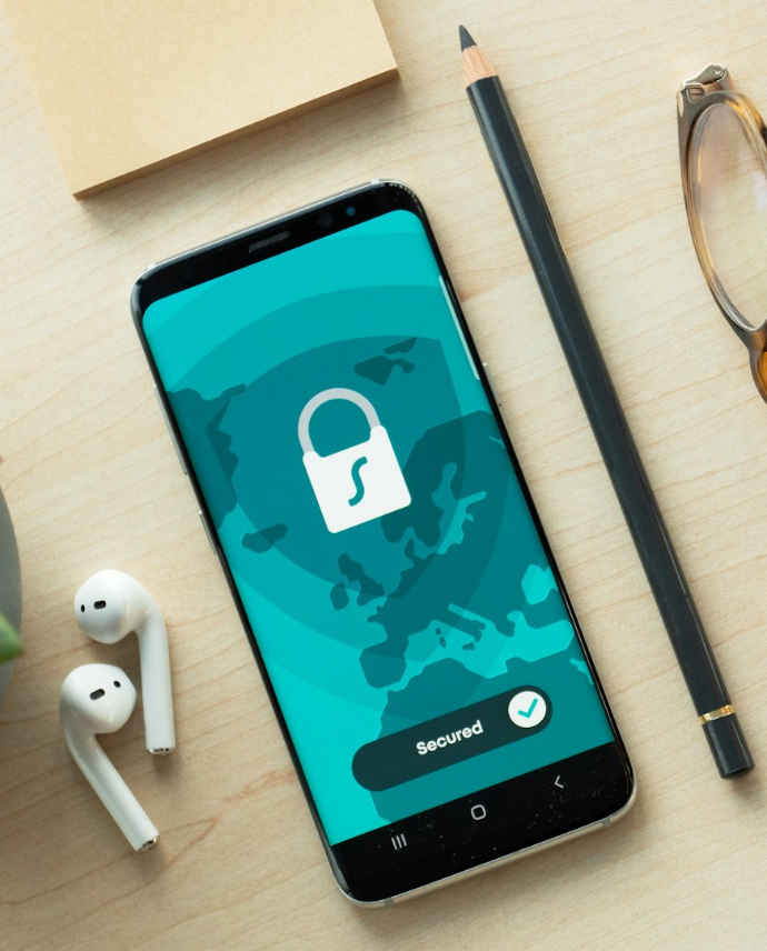 black iphone 5 beside brown framed eyeglasses and black iphone 5 c