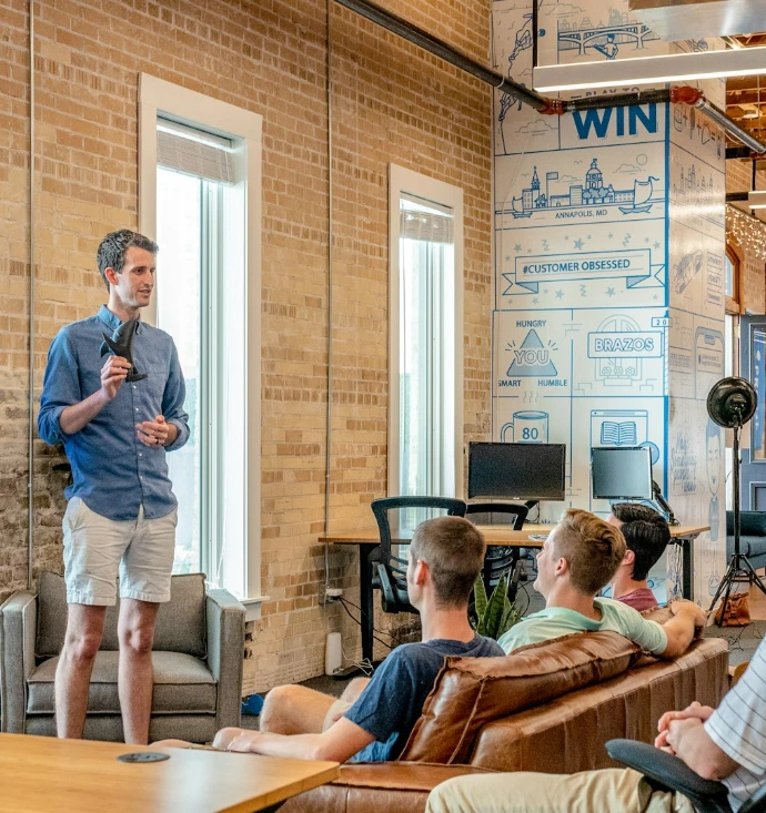 man standing in front of group of men